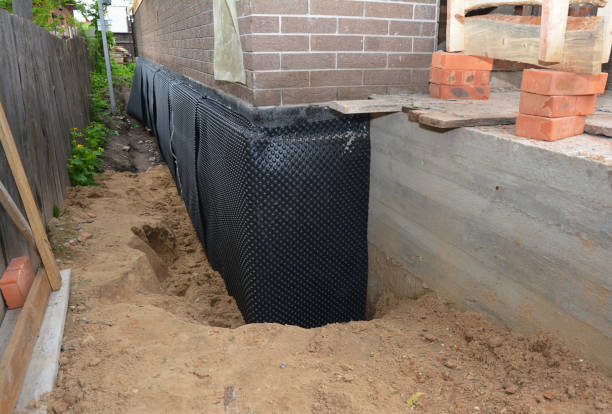 SJ Waterproofing Pros technician performing targeted Emergency Waterproofing assessment in Westwood, PA